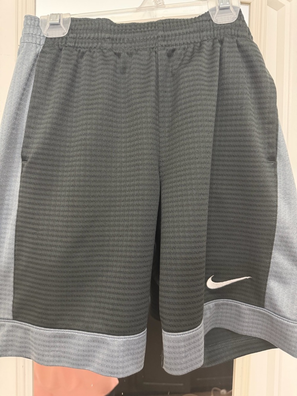 Nike Gray and Light Gray Athletic Shorts with White Swoosh